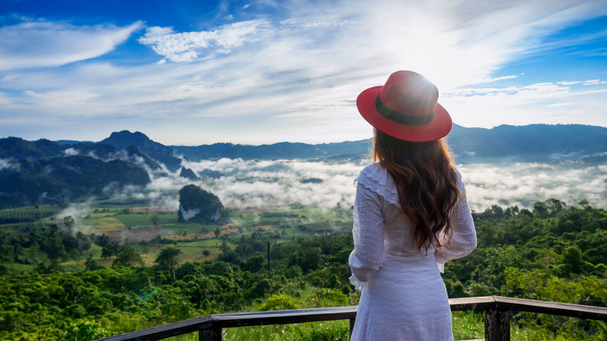 A young women traveller enjoying the scenic view of nature